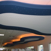 Cloud Feature Light Bulkheads with Tile Ceilings - Cambridge Junior Reading Area